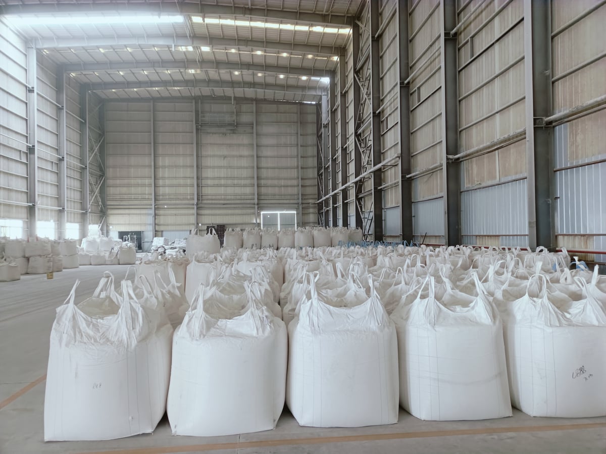 Jumbo bags of mineral powder stored in a warehouse