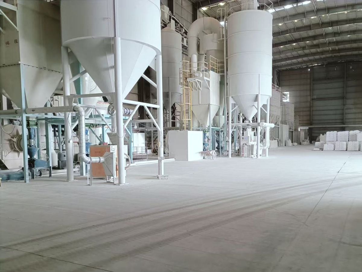 Mineral powder processing equipment and storage silos inside Xinruifeng’s factory